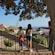 Two children standing at a scenic overlook viewing Cagliari's historic architecture